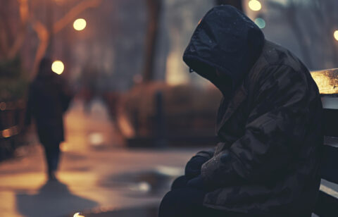 a-man-sitting-on-a-bench-and-looking-at-something-2026-01-08-00-18-02-utc